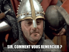 a man wearing a helmet and chain mail says sir comment vous remercier