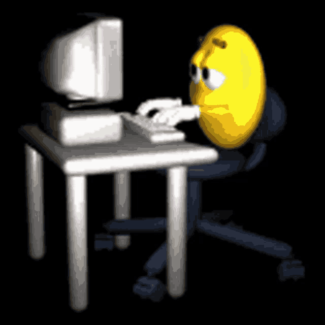 a yellow smiley face is sitting at a desk typing on a computer