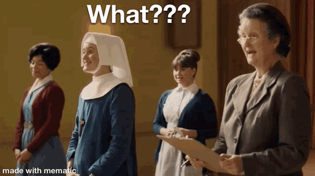a group of women are standing next to each other and one of them is wearing a nun 's head scarf .