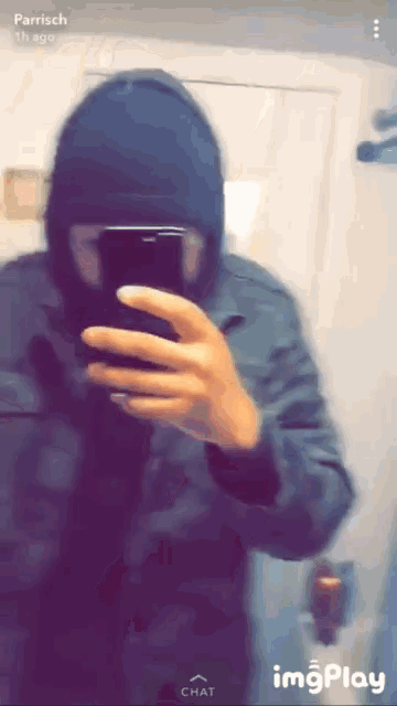 a person is taking a selfie with their phone and the name parrich is on the bottom right