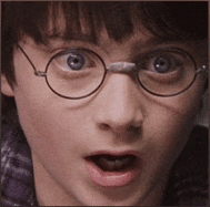 a close up of a person 's face with glasses on