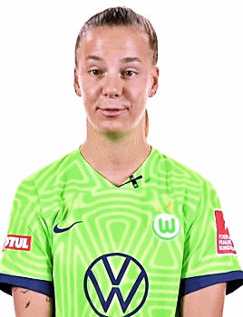 a young woman wearing a green soccer jersey with a vw logo on it .