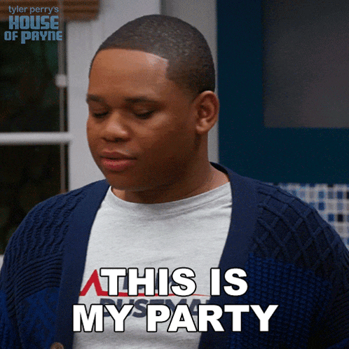 a man wearing a shirt that says this is my party looks down