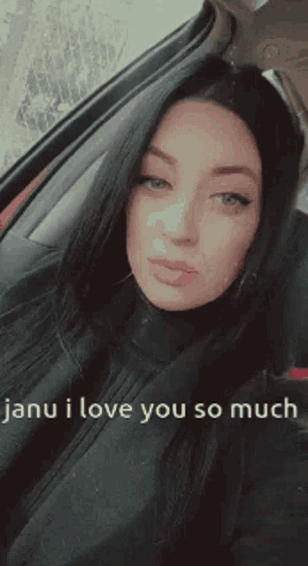 a woman sitting in a car with the words janu i love you so much