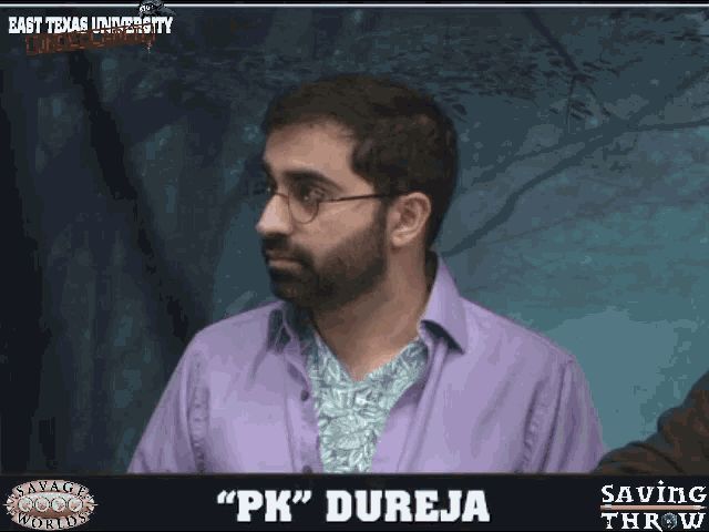 a man wearing glasses and a purple shirt has the name " pk " on his face
