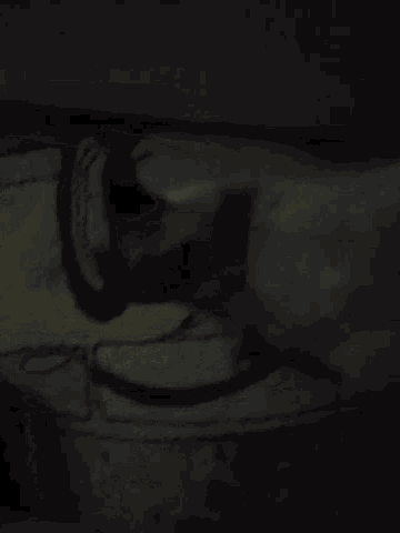 a close up of a drawing of a face with a black background