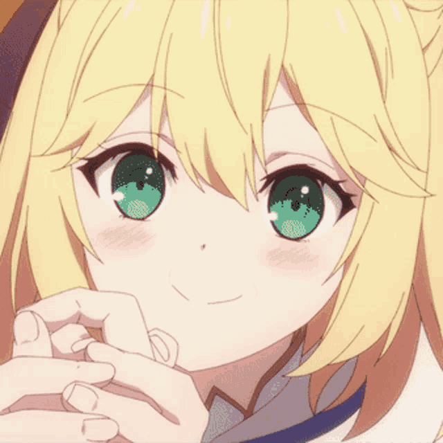 a close up of a girl with blonde hair smiling with her eyes closed