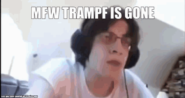 a man wearing headphones and glasses is making a funny face while looking at the camera .