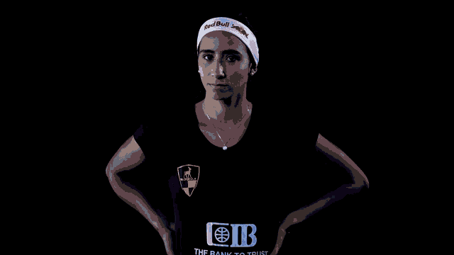 a woman wearing a headband that says redbull on it