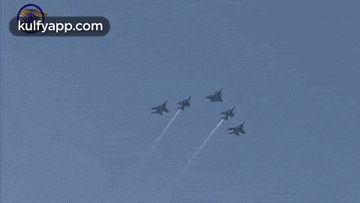 a group of fighter jets are flying in formation with the website kulfyapp.com at the bottom of the screen