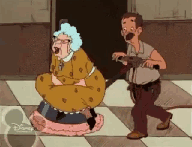 a man is holding a gun while a cartoon character is sitting on a chair .