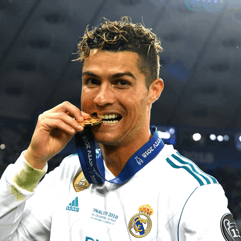 a soccer player with a medal around his neck that says final uefa 2018