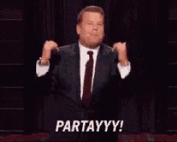 a man in a suit and tie is giving a speech and says partayyy !