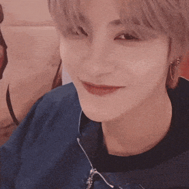 a close up of a person 's face with a smile on it