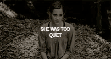 a woman is sitting in a pile of leaves with the words she was too quiet
