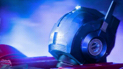 a close up of a robot 's head with a blue light on it .