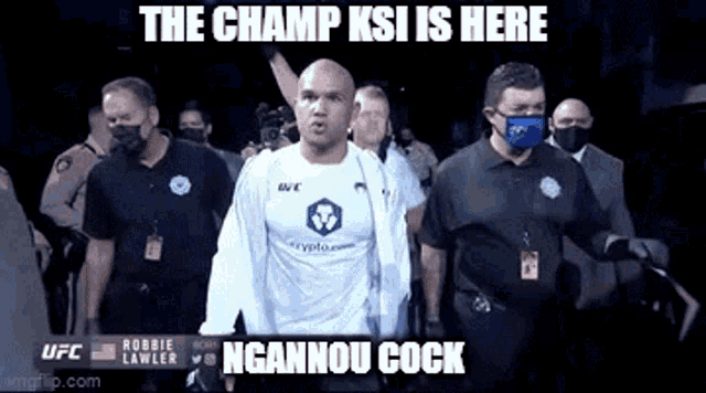 a man wearing a white shirt that says ufc is walking into the ring