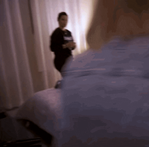 a blurry picture of a woman standing next to a man