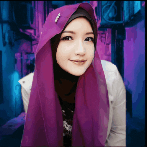 a woman wearing a purple hijab with a brooch on her ear
