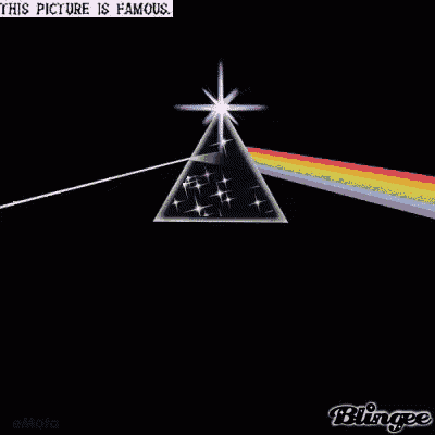 a pyramid with a rainbow coming out of it and a star in the middle .