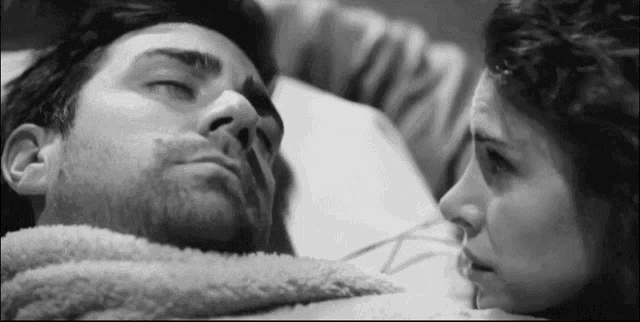 a black and white photo of a man and a woman