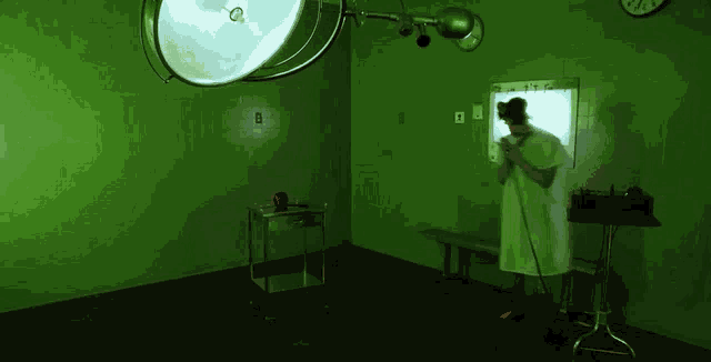 a nurse in an operating room with a microphone