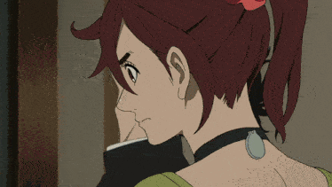 a close up of a woman 's face with a ponytail