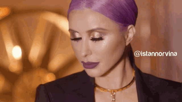 a woman with purple hair and a necklace has the hashtag @istannorvina on the bottom right
