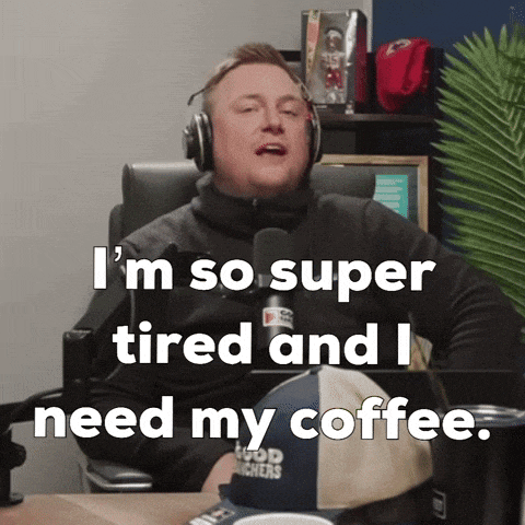 a man wearing headphones says i 'm so super tired and i need my coffee ..