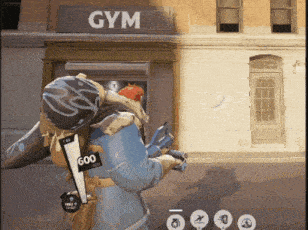 a person holding a gun in front of a sign that says gym