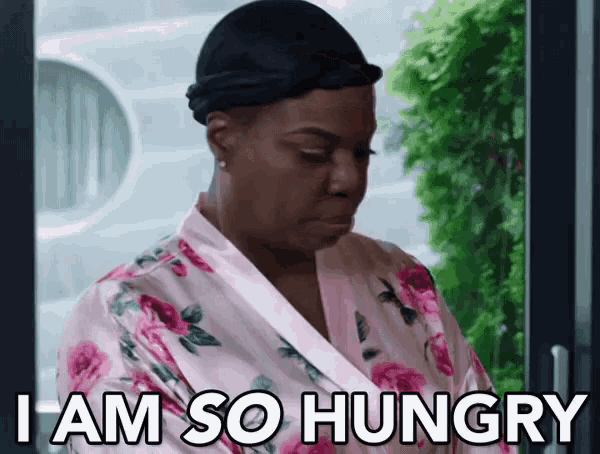 a woman in a floral robe says " i am so hungry "