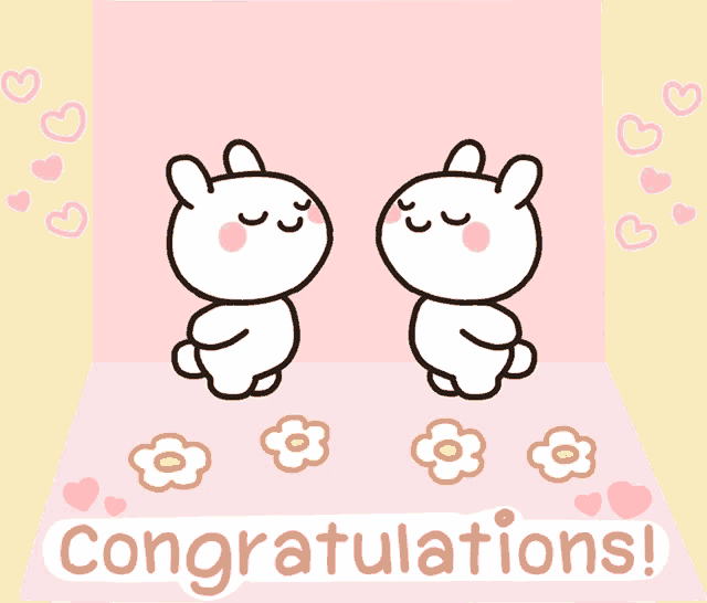 a congratulations card with two rabbits kissing and flowers