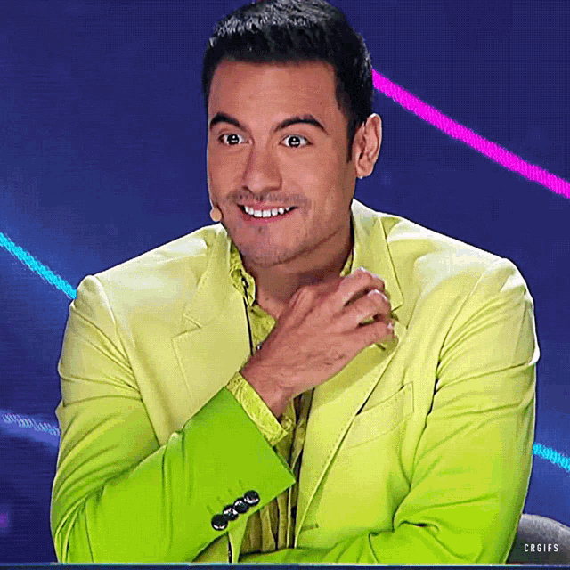 a man in a green jacket is smiling and looking at the camera with the caption craigs