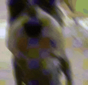 a blurry picture of a person 's face with a purple and green background
