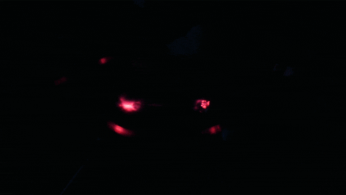 a close up of a glowing object with a purple background