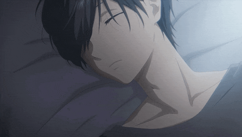a close up of a person sleeping on a bed