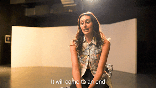 a woman sitting in a chair with the words " it will come to an end " written on the bottom