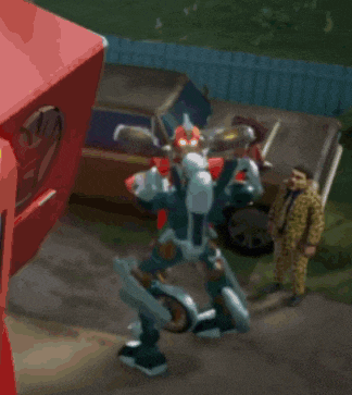a robot is standing in front of a red box that says volkswagen