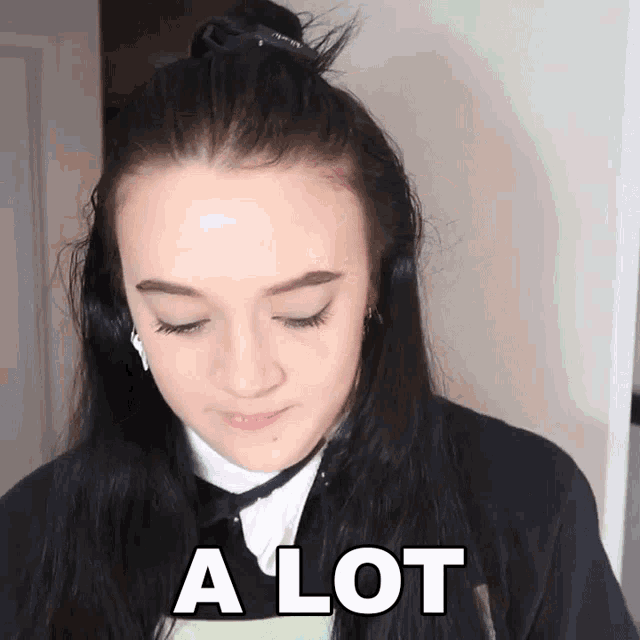 a girl wearing headphones says a lot in white letters