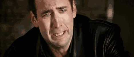 a man is crying with tears running down his face .