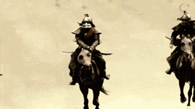 a person is holding a sword in their hand while riding a horse in the desert
