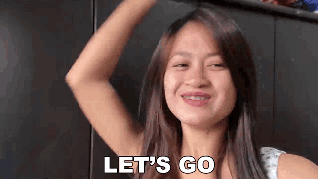 a woman with braces on her teeth is smiling and saying let 's go