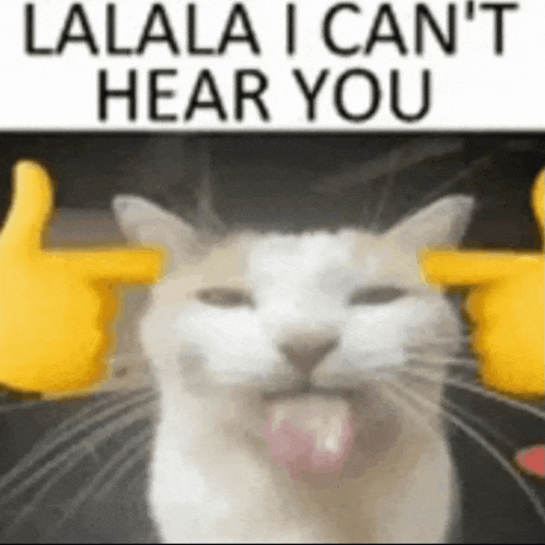 a cat is sticking its tongue out in front of a sign that says `` lalala i can t hear you '' .