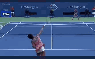 a tennis match is being played in front of a wall that says j.p. morgan