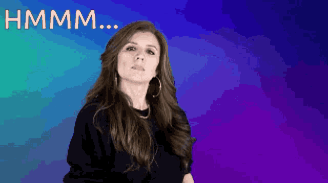 a woman stands in front of a blue and purple background with the words hmmm written above her