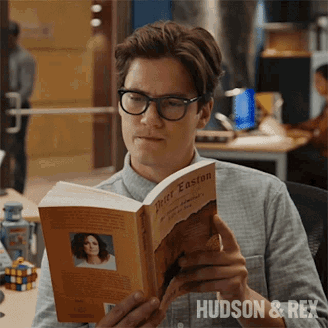 Reading A Book Jesse Mills GIF - Reading A Book Jesse Mills Hudson And Rex GIFs
