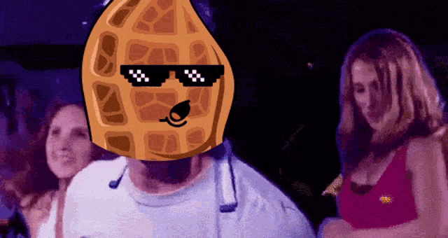a man with a peanut on his head wearing sunglasses and a microphone