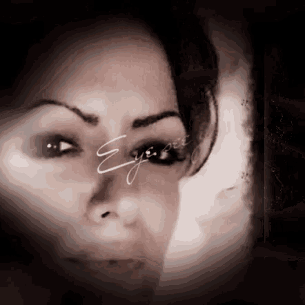 a close up of a woman 's face with the word eye visible in the corner
