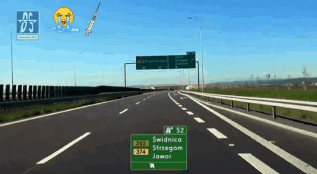 a highway with a green sign that says swidnica strzegom jawor