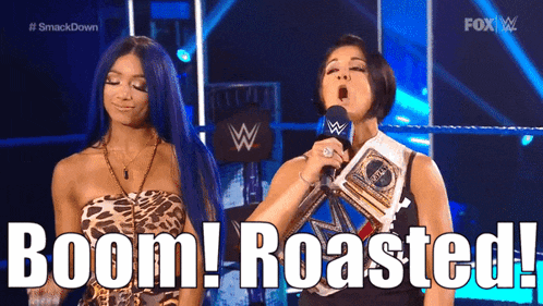 two women standing next to each other on a stage with the words boom roasted behind them